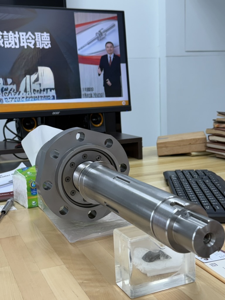 Planetary roller screw assembly on a table